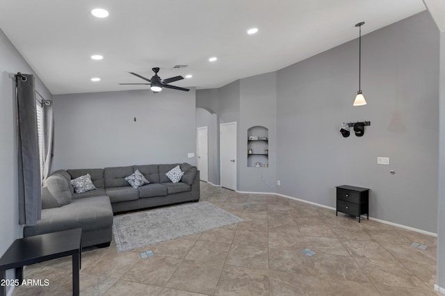 living area featuring visible vents, arched walkways, ceiling fan, and recessed lighting