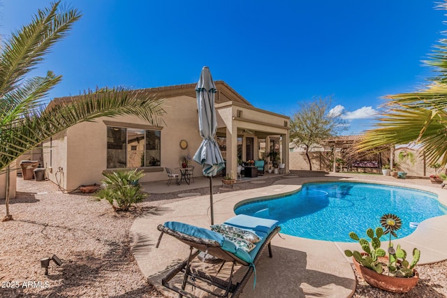 view of pool featuring a fenced in pool, a patio area, and fence