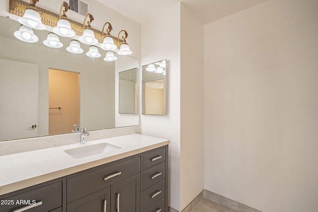 bathroom with vanity and baseboards