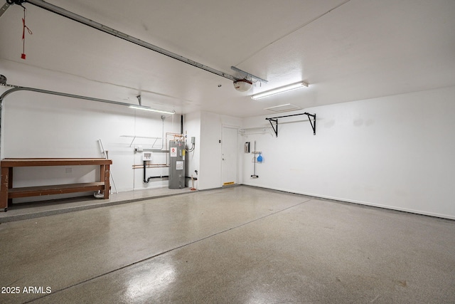 garage with a garage door opener and electric water heater