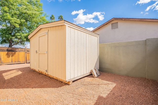 view of shed with a fenced backyard