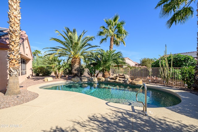 view of swimming pool featuring a patio area