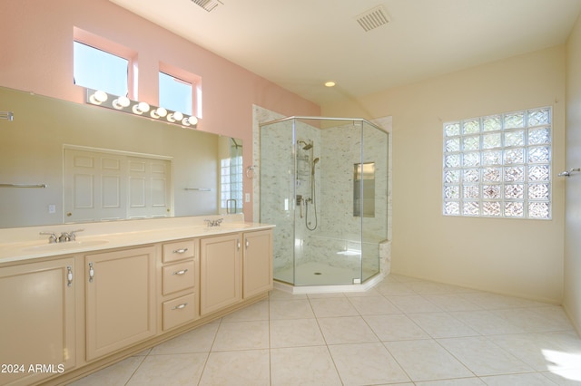 bathroom with vanity, tile patterned floors, and a shower with shower door