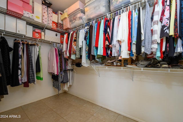 walk in closet featuring light tile patterned floors