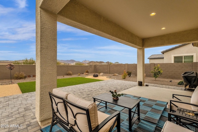 view of patio / terrace featuring a mountain view