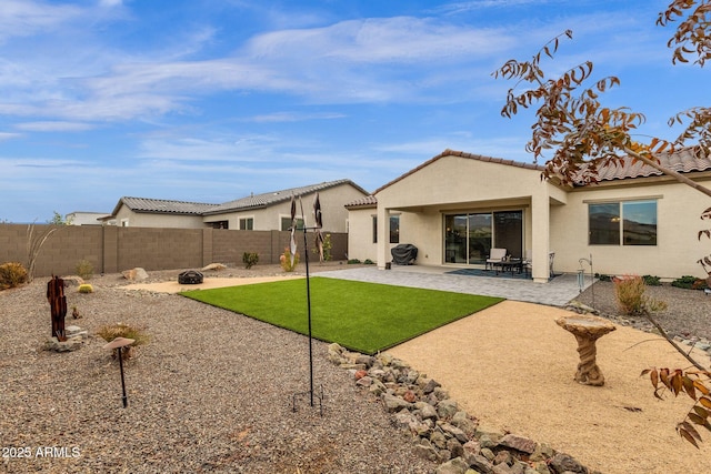 rear view of house with a patio