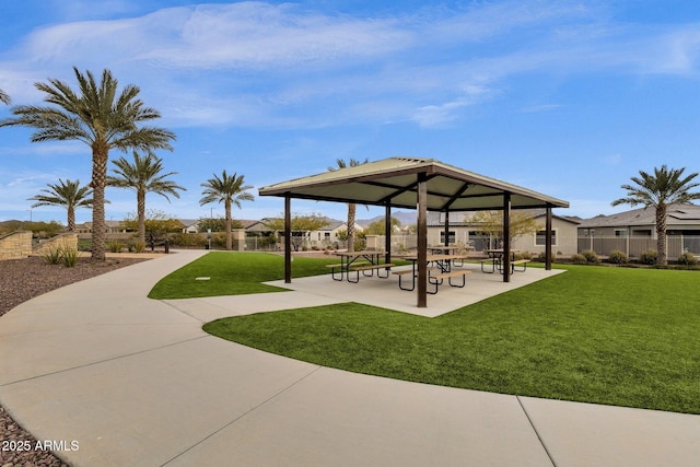 surrounding community with a gazebo and a lawn