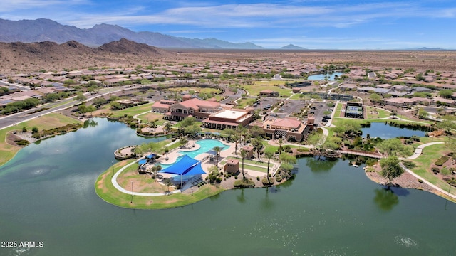 bird's eye view with a water and mountain view