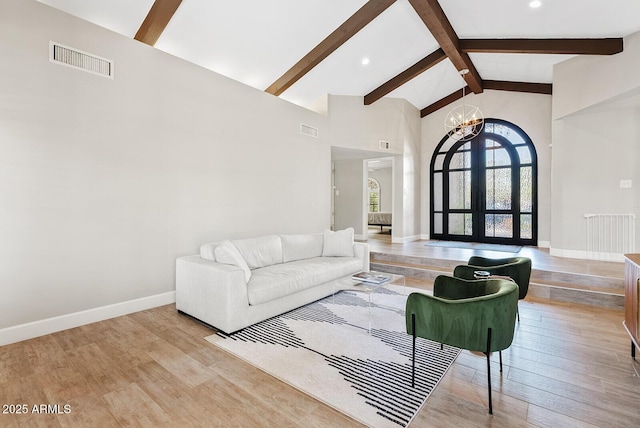 8361 E San Rafael Dr, Scottsdale, AZ 85258 - living room featuring a chandelier, beam ceiling, high vaulted ceiling, light wood-style flooring, and recessed lighting