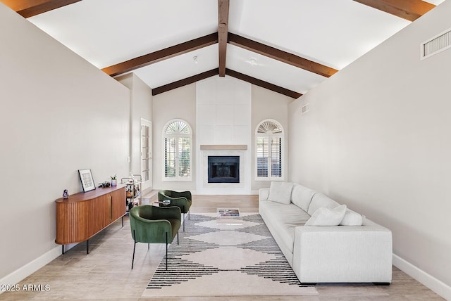 8361 E San Rafael Dr, Scottsdale, AZ 85258 - living room with beamed ceiling, high vaulted ceiling, and a large fireplace