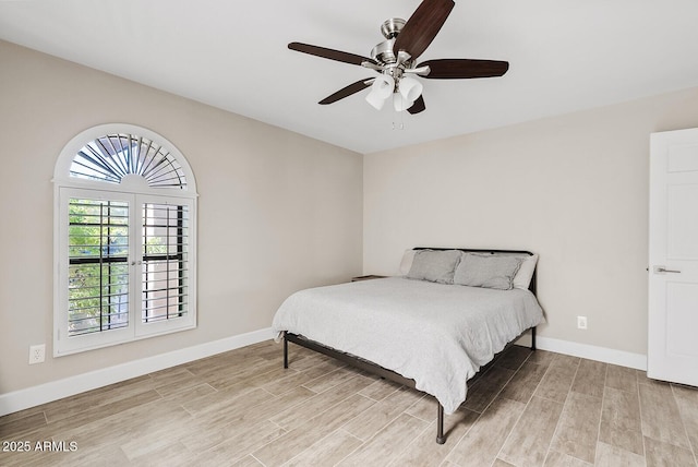 8361 E San Rafael Dr, Scottsdale, AZ 85258 - bedroom featuring light wood-style flooring, multiple windows, and ceiling fan