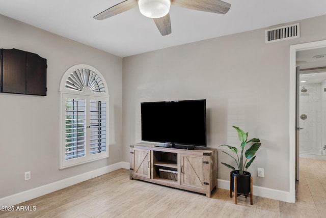 8361 E San Rafael Dr, Scottsdale, AZ 85258 - living area featuring a ceiling fan and light wood-style flooring