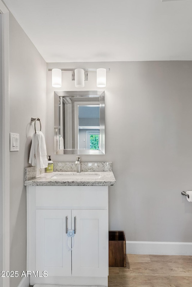 8361 E San Rafael Dr, Scottsdale, AZ 85258 - bathroom with wood finished floors and vanity