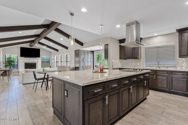 8361 E San Rafael Dr, Scottsdale, AZ 85258 - kitchen featuring island exhaust hood, a ceiling fan, plenty of natural light, decorative backsplash, and recessed lighting