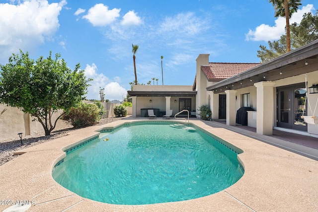 8361 E San Rafael Dr, Scottsdale, AZ 85258 - view of pool with a patio area, french doors, and a fenced backyard