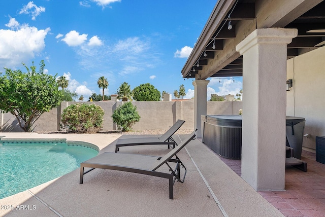 8361 E San Rafael Dr, Scottsdale, AZ 85258 - view of pool featuring a hot tub, a patio area, and a fenced backyard