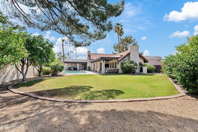 8361 E San Rafael Dr, Scottsdale, AZ 85258 - rear view of property featuring stucco siding, a chimney, a tiled roof, a fenced backyard, and a patio area