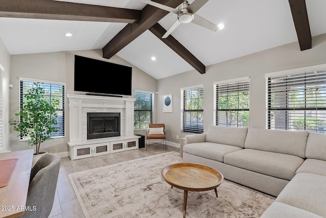 8361 E San Rafael Dr, Scottsdale, AZ 85258 - living area featuring a ceiling fan, wood finished floors, a high end fireplace, and recessed lighting
