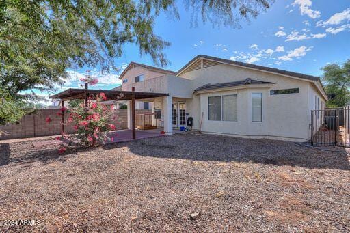 back of property with a patio