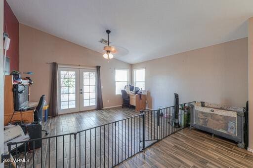 interior space featuring ceiling fan, french doors, vaulted ceiling, and hardwood / wood-style flooring