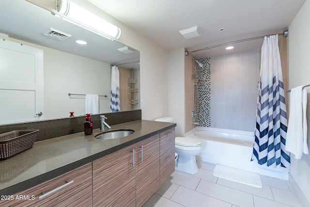 full bathroom featuring toilet, tile patterned floors, vanity, and shower / bathtub combination with curtain