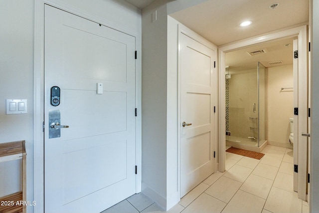 entrance foyer with light tile patterned floors