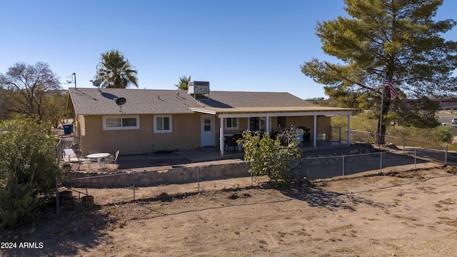 view of front facade with central AC unit and a patio