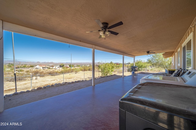 view of patio featuring ceiling fan