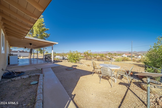 view of patio featuring ceiling fan