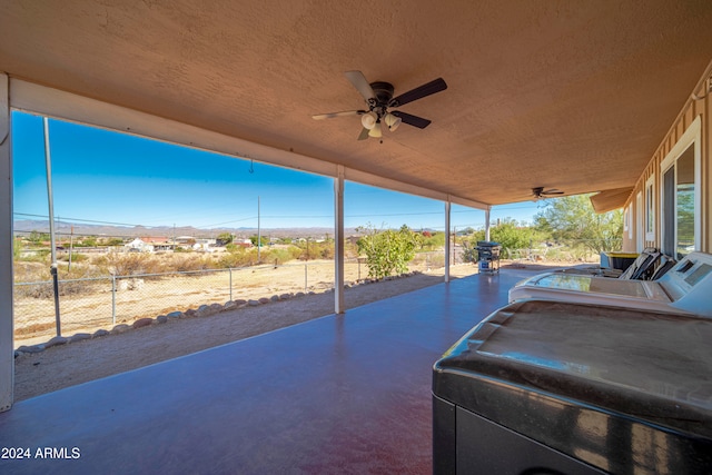 view of patio featuring ceiling fan