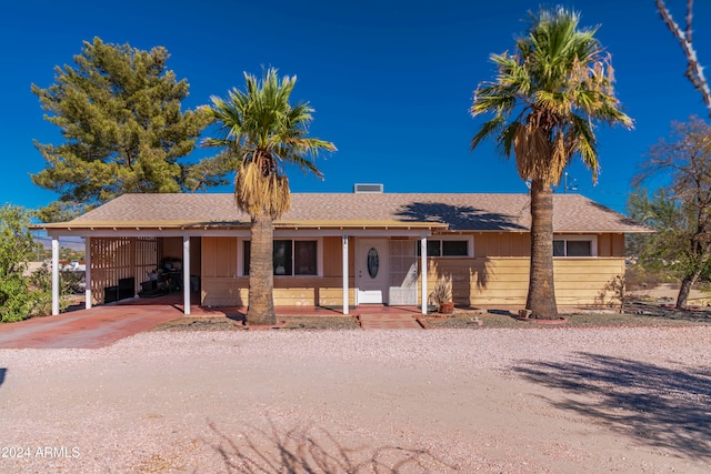 single story home with a carport