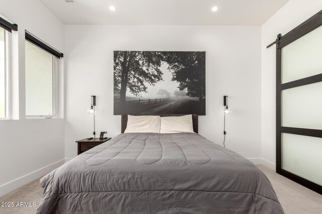 540 W Mariposa St Unit 9, Phoenix, AZ 85013 - bedroom featuring a barn door, carpet flooring, baseboards, and recessed lighting