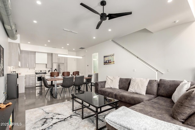 540 W Mariposa St Unit 9, Phoenix, AZ 85013 - living room with a ceiling fan, recessed lighting, stairs, and finished concrete flooring