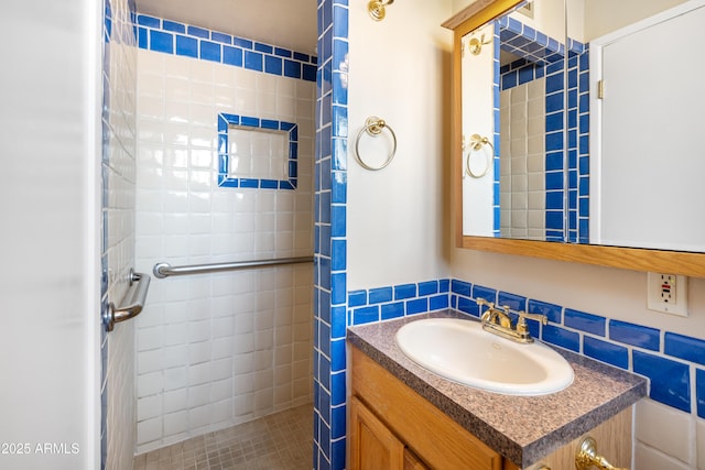 full bathroom featuring a stall shower and vanity