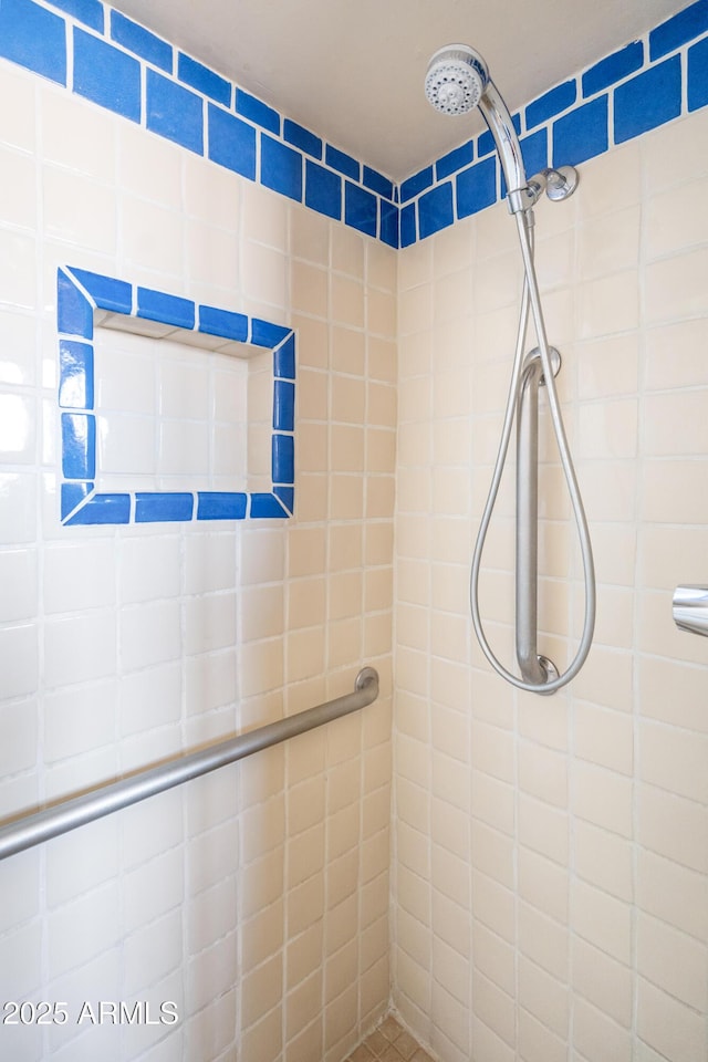 full bathroom with tiled shower