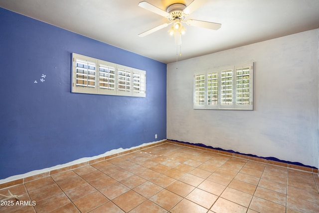 spare room with ceiling fan