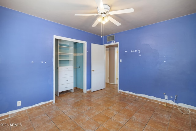 unfurnished bedroom with light tile patterned flooring, visible vents, a closet, and ceiling fan