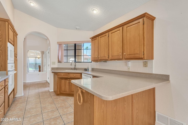 kitchen featuring light countertops, white appliances, visible vents, and light tile patterned floors