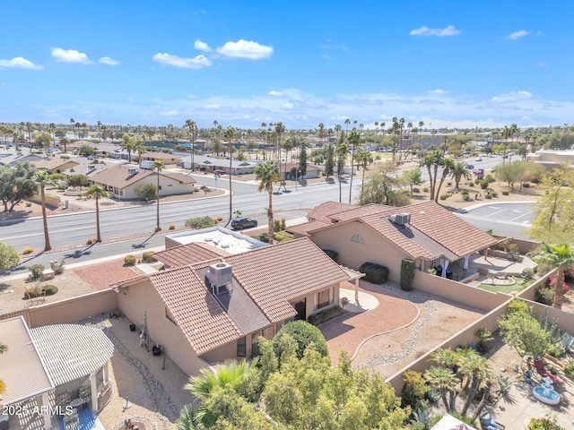 birds eye view of property with a residential view