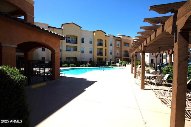 community pool featuring a patio area