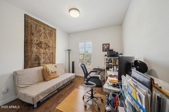 office space with baseboards and wood finished floors
