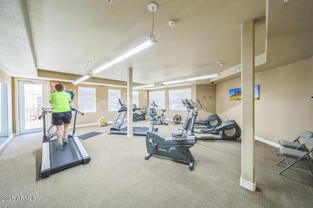 workout area with carpet floors and baseboards