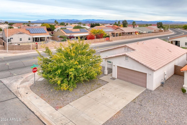 birds eye view of property featuring a mountain view