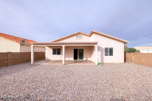 rear view of property with a patio area