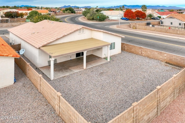 birds eye view of property with a mountain view