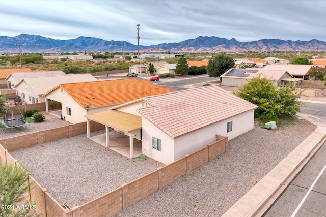 birds eye view of property with a mountain view