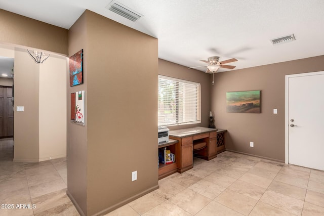 office area featuring visible vents, ceiling fan, and light tile patterned floors