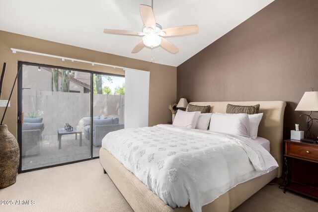 carpeted bedroom featuring vaulted ceiling, ceiling fan, and access to exterior