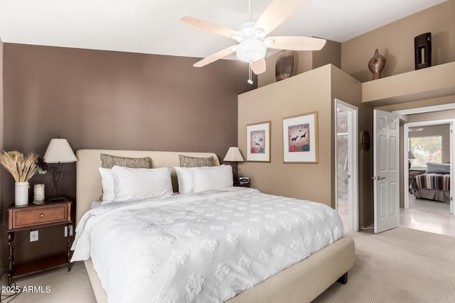 bedroom featuring a ceiling fan and light carpet