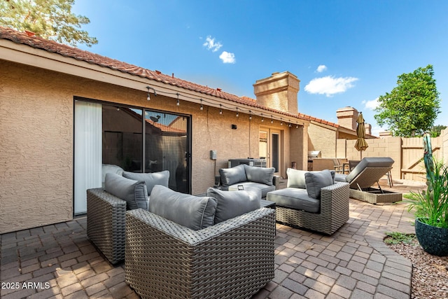 view of patio / terrace featuring fence and an outdoor hangout area